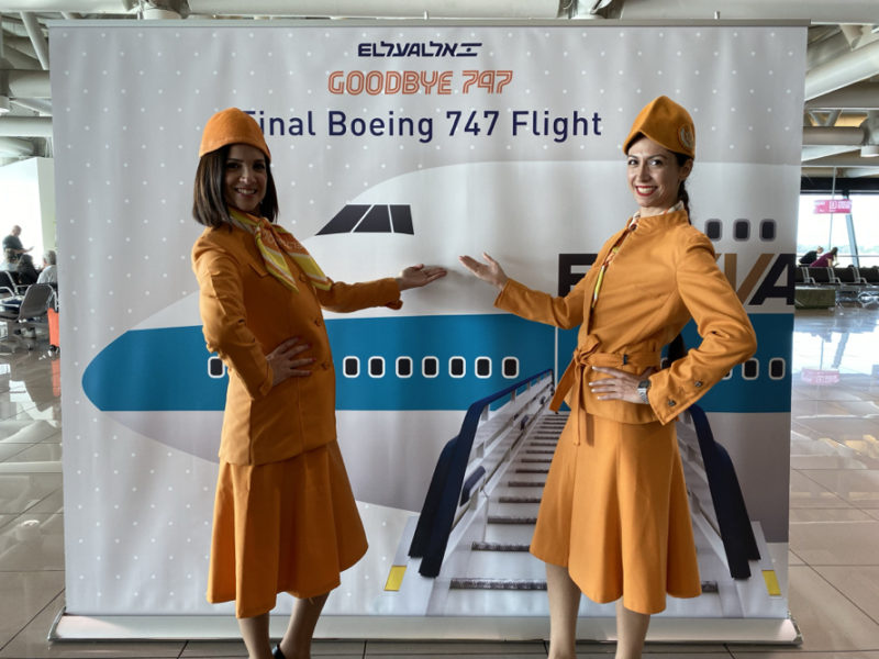 two women in orange uniforms