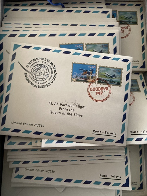 a stack of envelopes with stamps