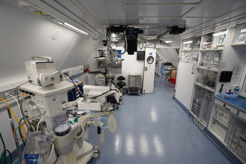 a room with white equipment and shelves
