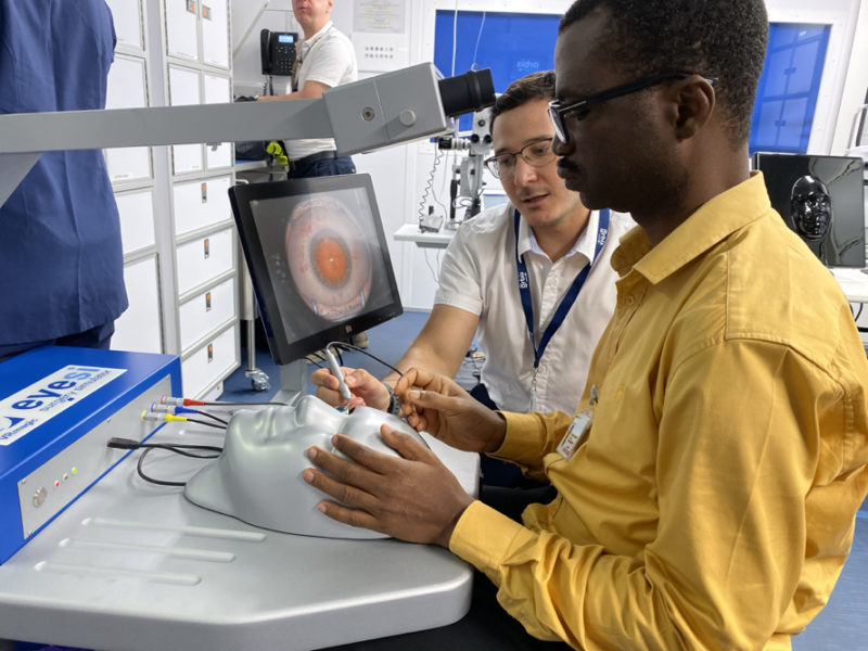 a man using a computer to check the eye vision