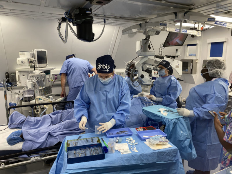 a group of people in a operating room