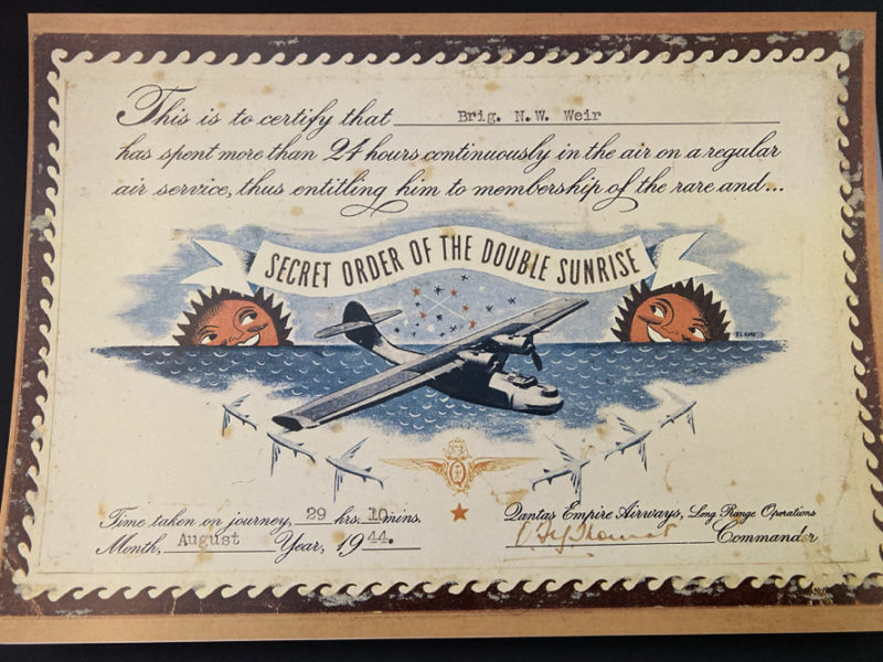 a certificate with a picture of an airplane and water