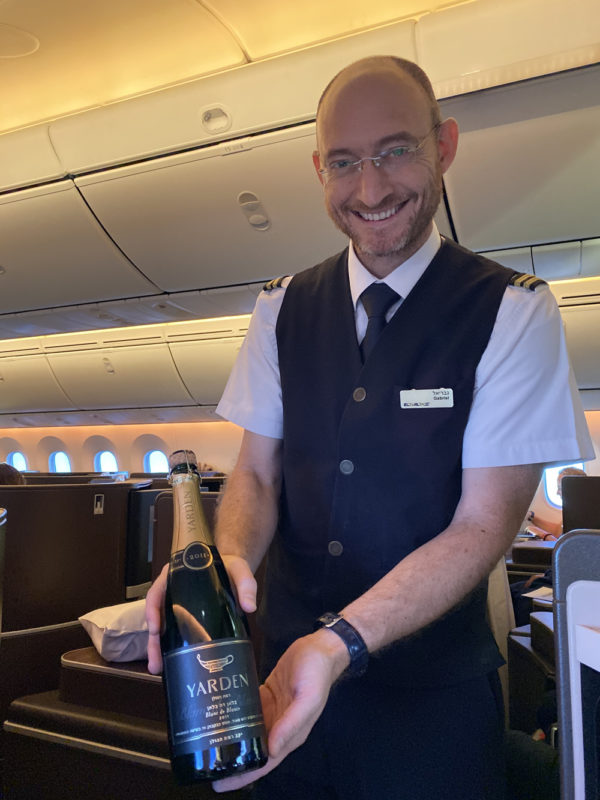 a man holding a bottle of champagne