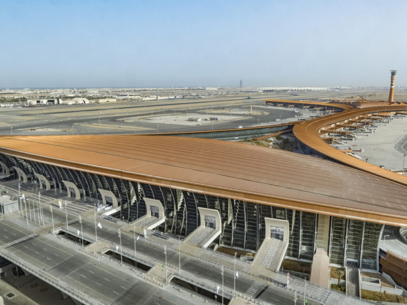 a large airport with a curved roof