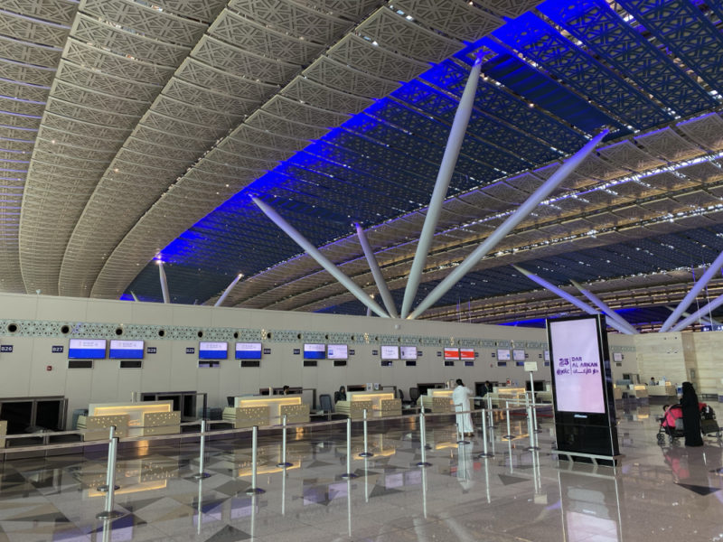 a large airport with many screens
