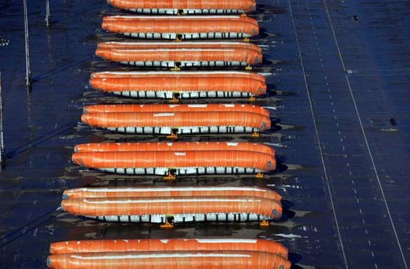 a group of large orange boats