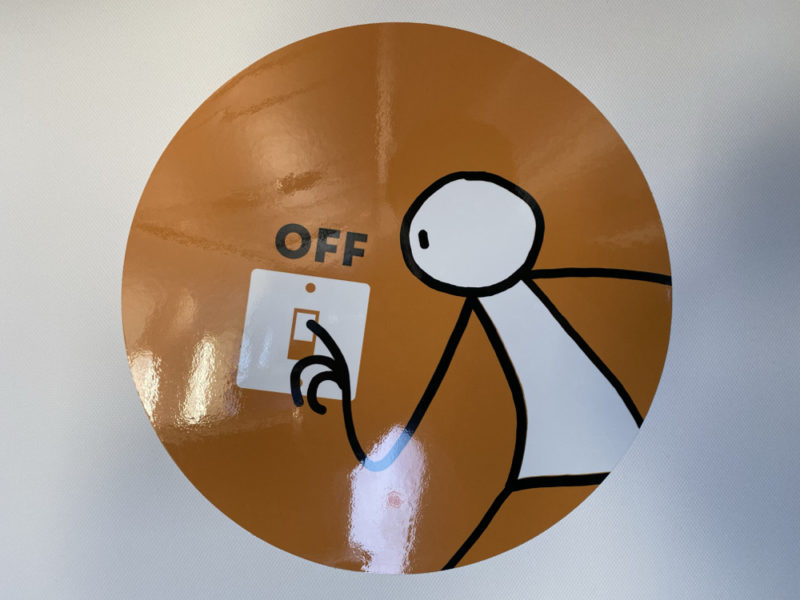 a stick figure on a light switch