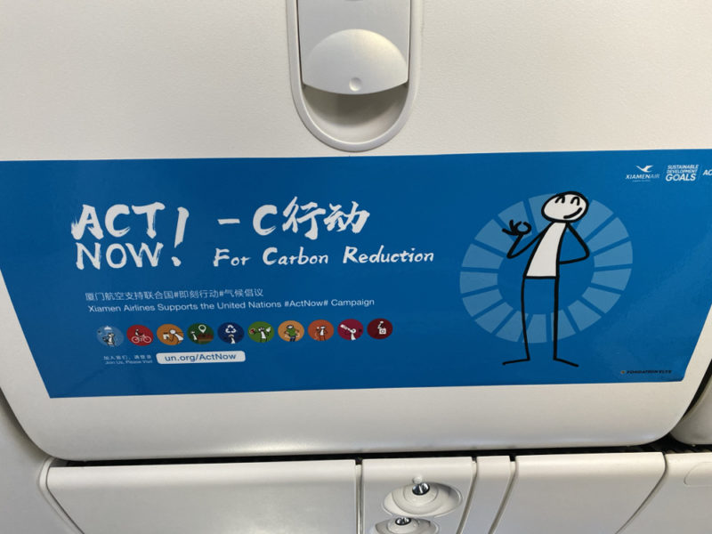 a blue and white sign on a plane