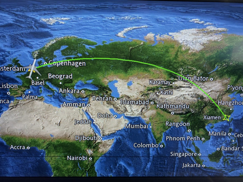 a map of the world with a plane flying