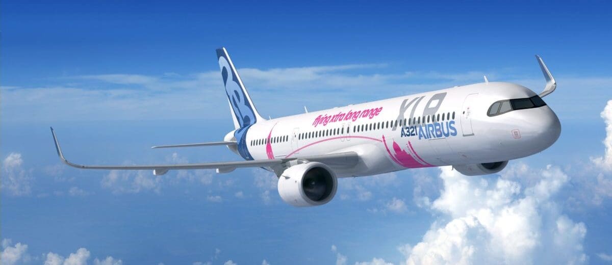 a white airplane flying in the sky