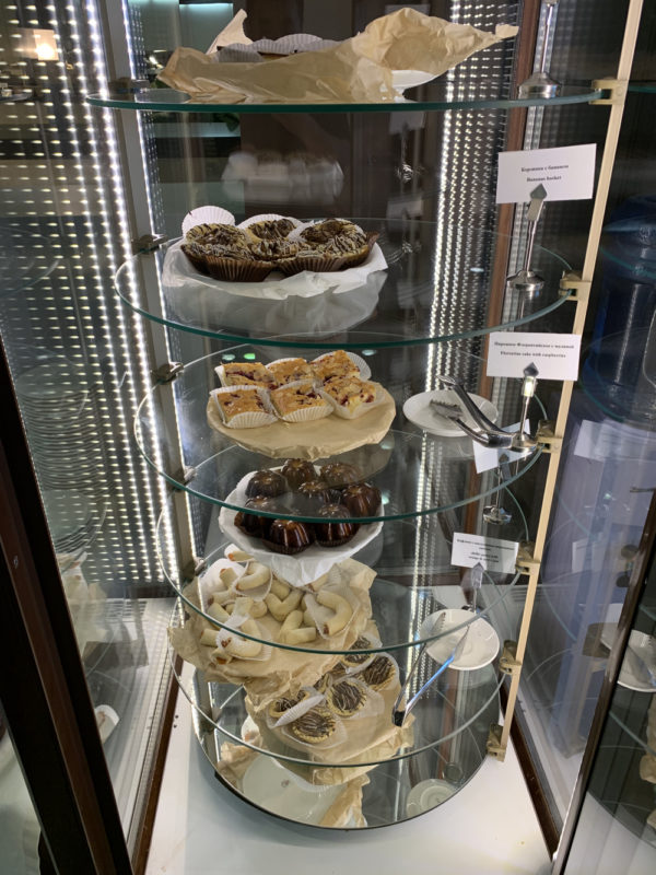 a glass display case with food on it