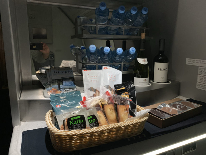 a basket of food and bottles of water