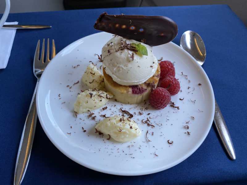 a plate of dessert with ice cream and chocolate on top