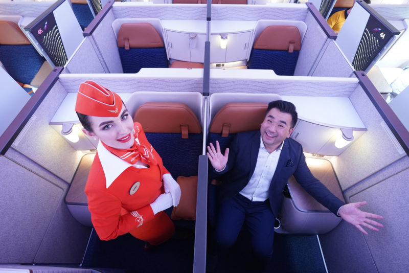 a man and woman in an airplane