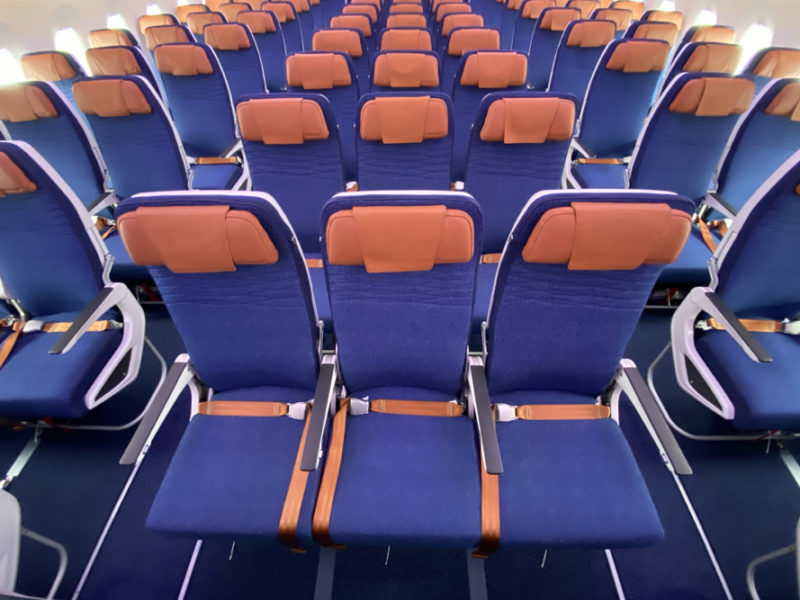 rows of blue and orange chairs