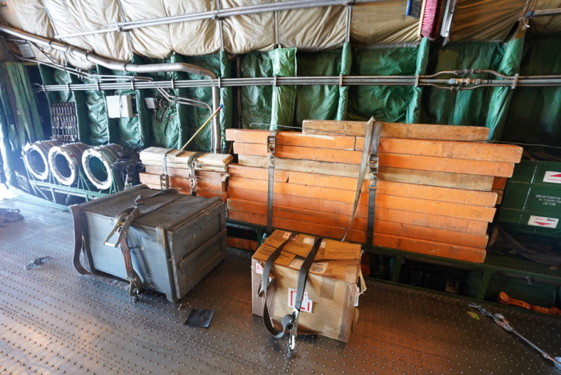 a room with boxes and a metal wall