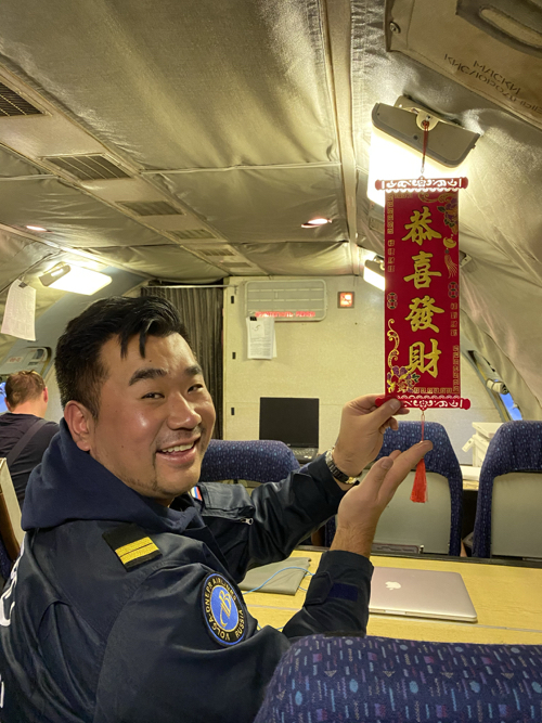 a man holding a red banner