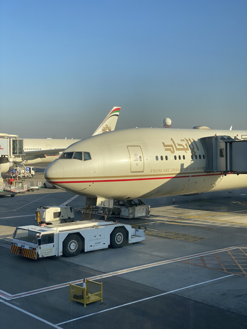 a white airplane on a runway