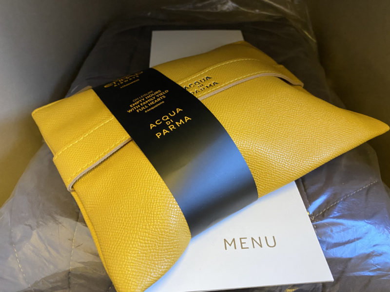 a yellow bag with a black label on it