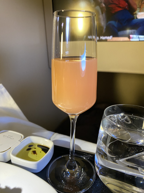 a glass of champagne on a tray