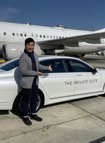 a man standing next to a car