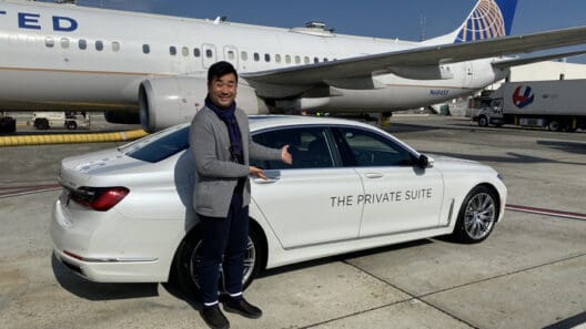 a man standing next to a car