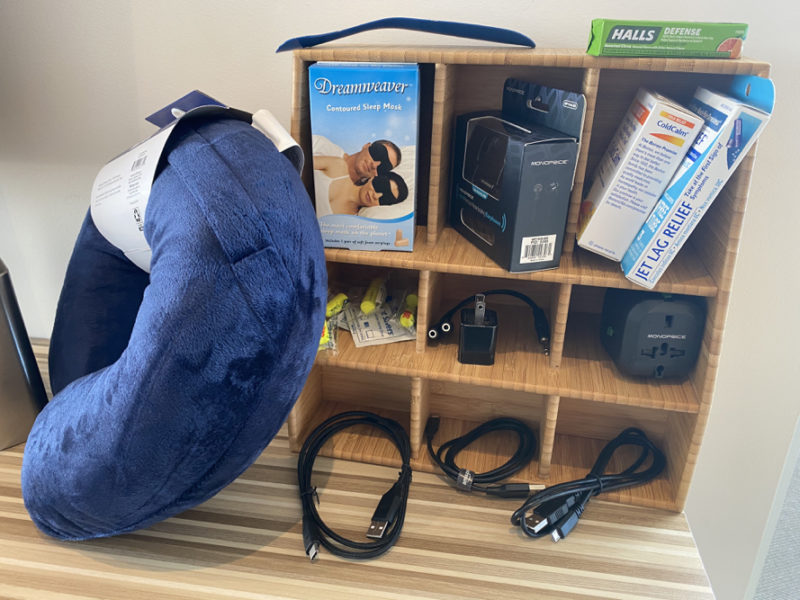 a shelf with a pillow and other items