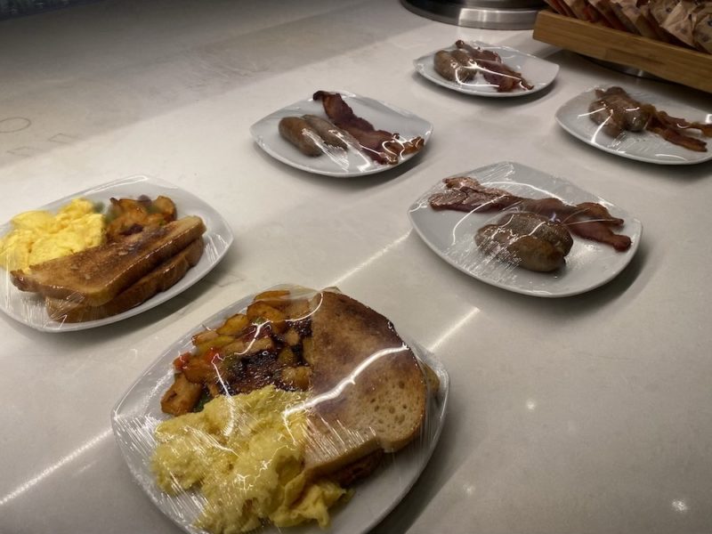 plates of food wrapped in plastic