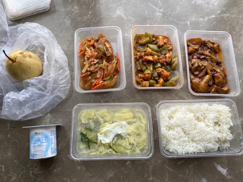 a group of plastic containers with food in them