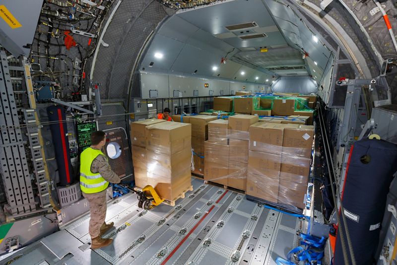 a man standing in a cargo plane