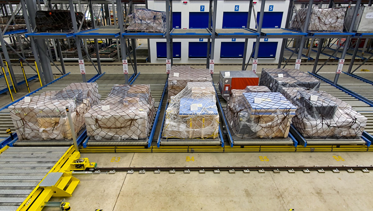 a warehouse with boxes wrapped in ropes