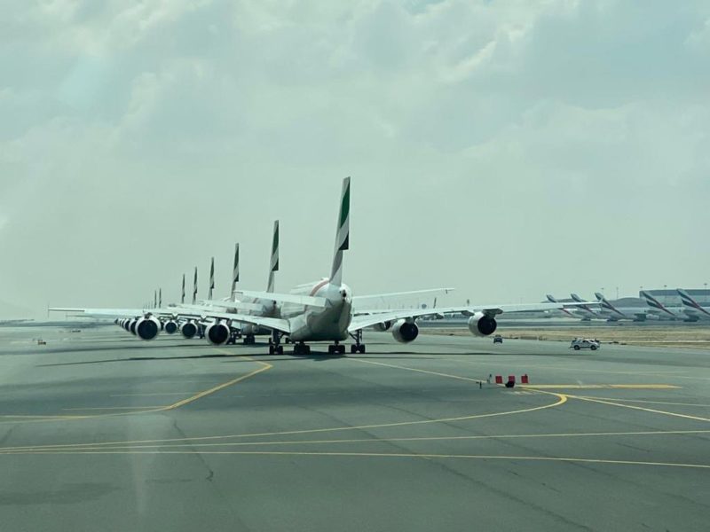 a row of airplanes on a runway