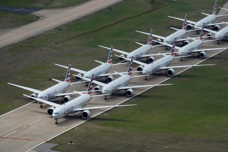 a group of airplanes on a runway