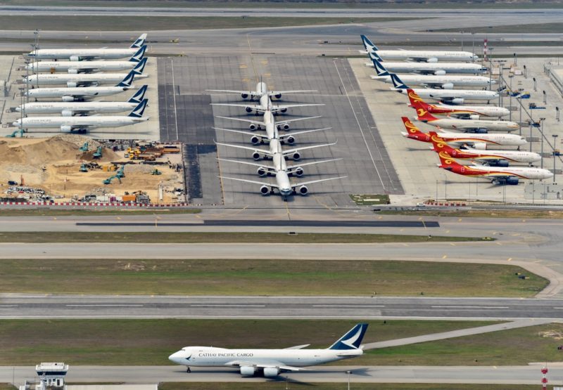 an aerial view of airplanes on a runway