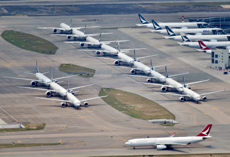 a group of airplanes on a runway