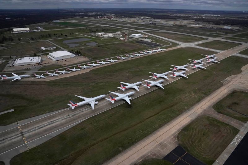 a group of airplanes on a runway