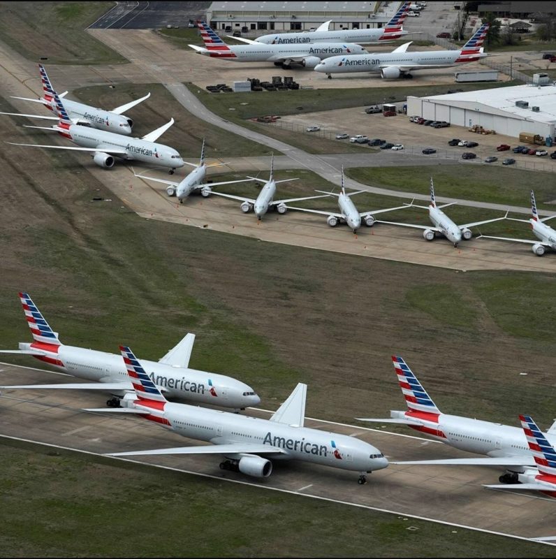 a group of airplanes on a runway