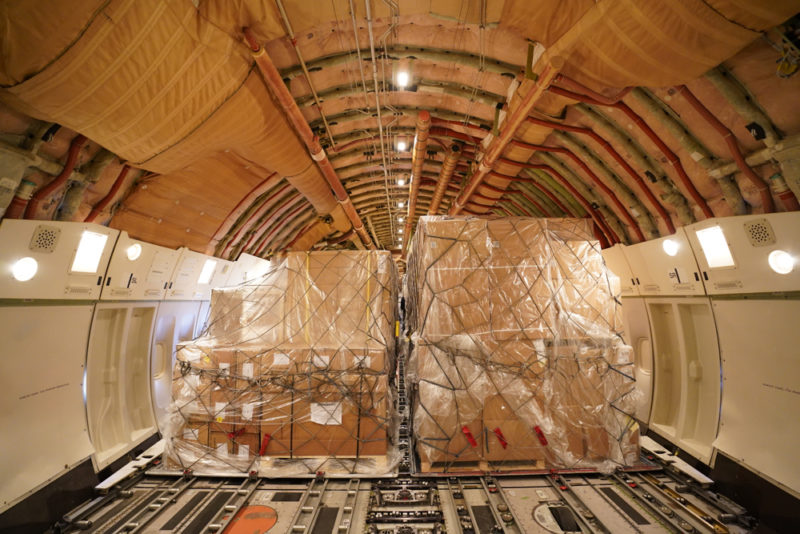boxes wrapped in plastic inside a plane
