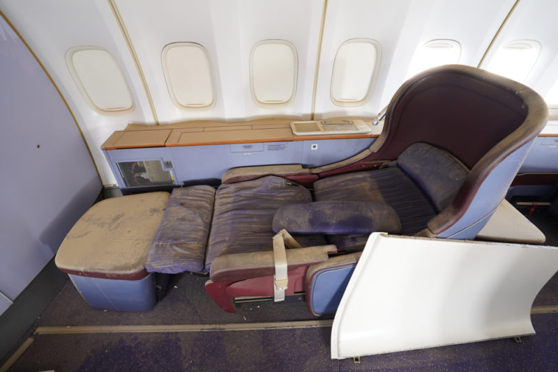 an airplane seat with a seat and a seat cushion