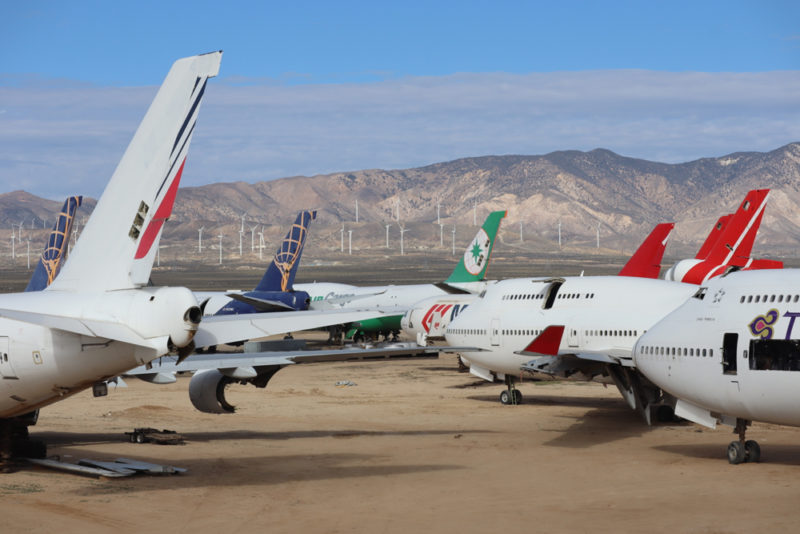 airplanes parked on a desert