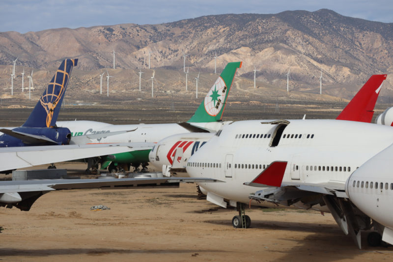 a group of airplanes parked on a runway