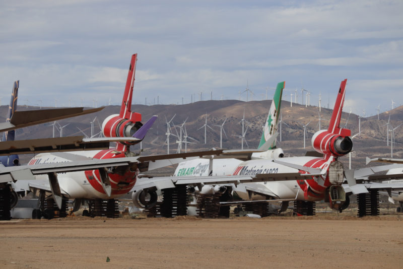 a group of airplanes on a field