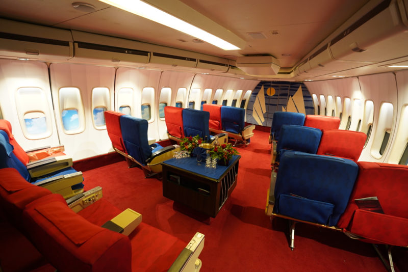 a plane with red and blue seats