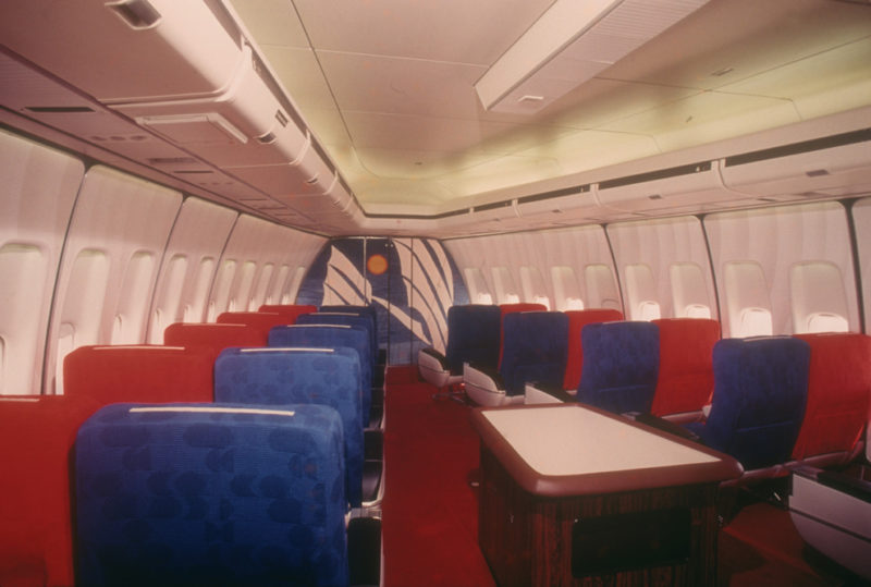 an airplane with red and blue seats