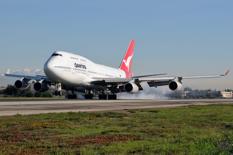 a large white airplane on a runway