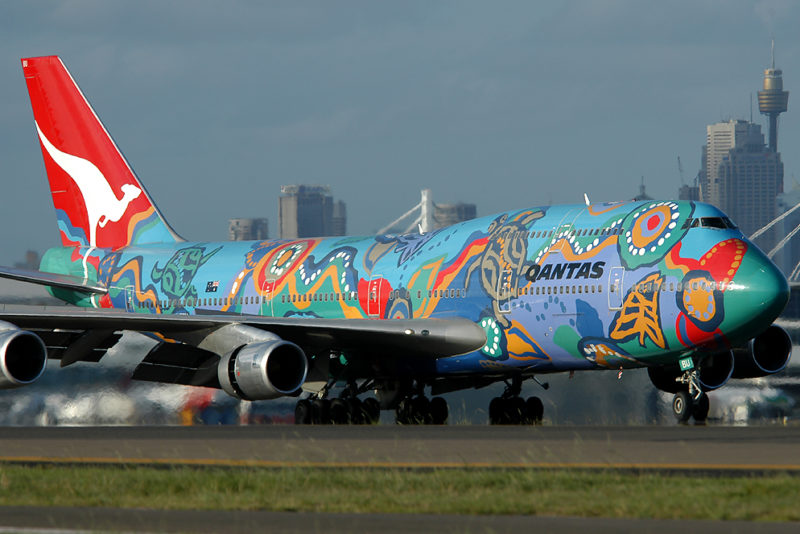 a colorful airplane on a runway