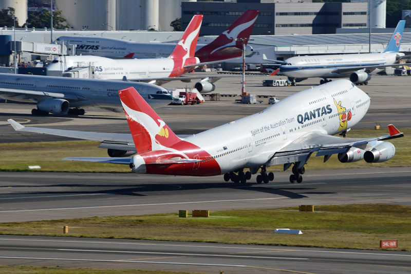 a group of airplanes on a runway