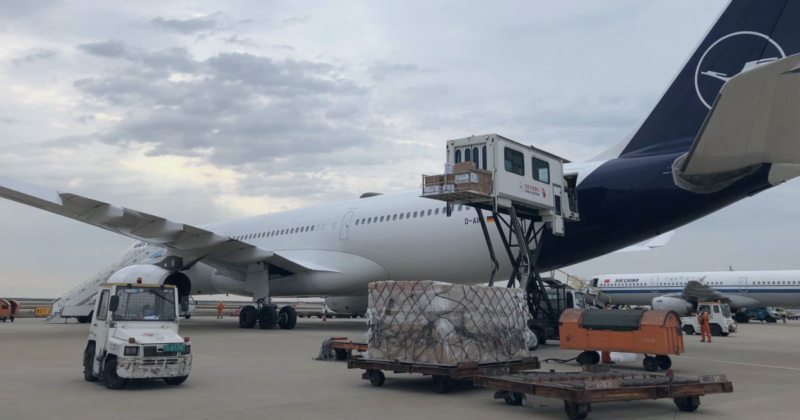 a large airplane with luggage on it