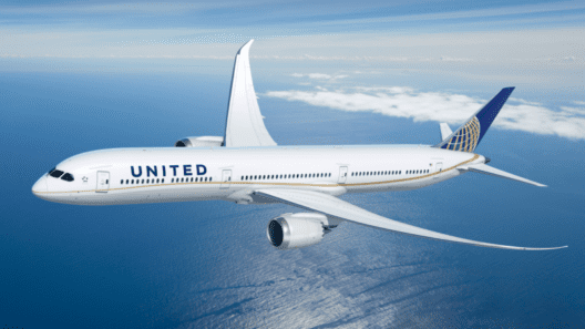 a white airplane flying in the sky