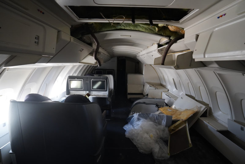 inside an airplane with a few monitors